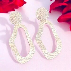 Stylish Silver Statement Earrings with Textured Design and Open Teardrop Shape